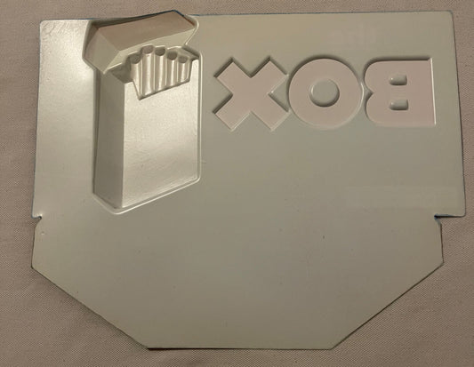 Cream-colored embossed plastic cigarette pack display showing Winston branding and "THE BOX" text with a 3D cigarette pack re