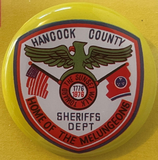 Vintage Hancock County TN Sheriffs Dept pinback button with eagle emblem, red and blue design on yellow background.
