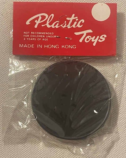 Vintage sealed plastic dexterity puzzle toy in black dome shape with red cardboard box labeled "Plastic Toys," made in Hong K