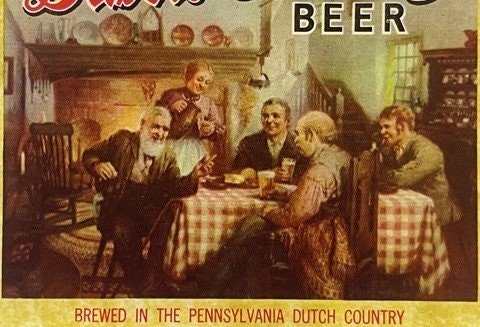 Vintage beer label showing men gathered around a table with drinks in a rustic interior, text reads "BEER" and "Brewed in the