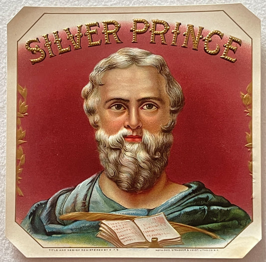 Vintage cigar box label featuring bearded man in classical robes with open book, "Silver Prince" text in gold lettering on re