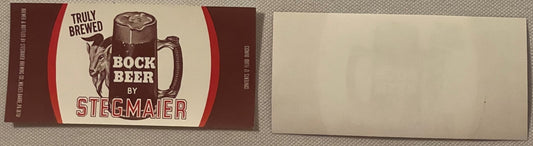 Vintage Stegmaier Bock Beer label and blank backing shown flat, featuring a goat and beer mug design in red, brown and cream