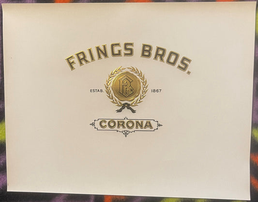 Gold embossed cigar label for Frings Bros Corona tobacco, established 1867, with ornate wreath and ribbon design on cream pap