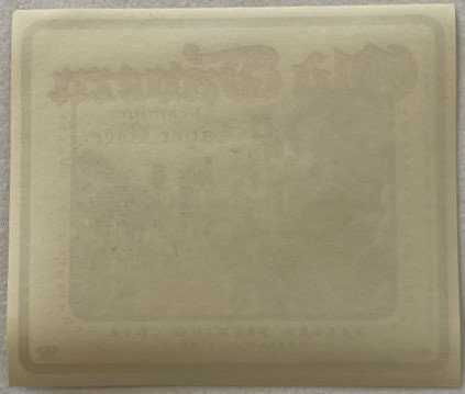 Cream-colored ceramic or plaster mold with embossed rectangular design and faint text impressions, photographed flat against