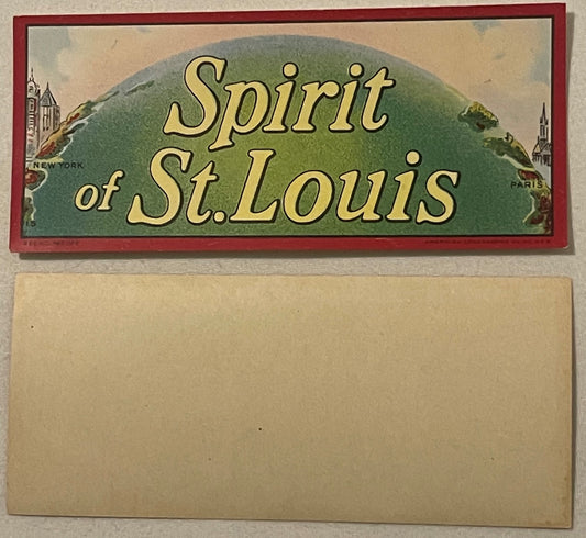 Vintage "Spirit of St. Louis" cigar label with green globe, gold lettering, and red border, showing New York and Paris landma