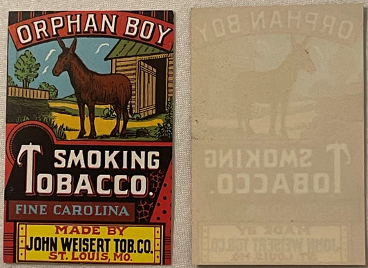 Vintage tobacco label with brown donkey beside wooden shed, red banner reading "Orphan Boy Smoking Tobacco," maker details fo