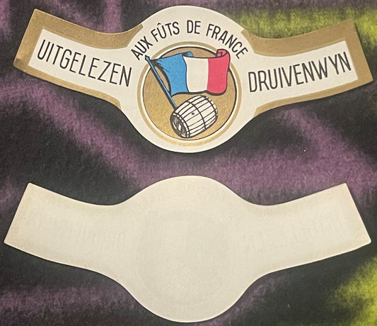 Two vintage wine bottle neck labels with French flag and barrel imagery; upper label shows text "Uitgelezen," "Aux Fûts de Fr