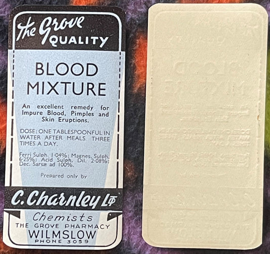 Vintage blood mixture medicine label and cream-colored bottle from C. Charnley Ltd chemist, Wilmslow, with dosage instruction