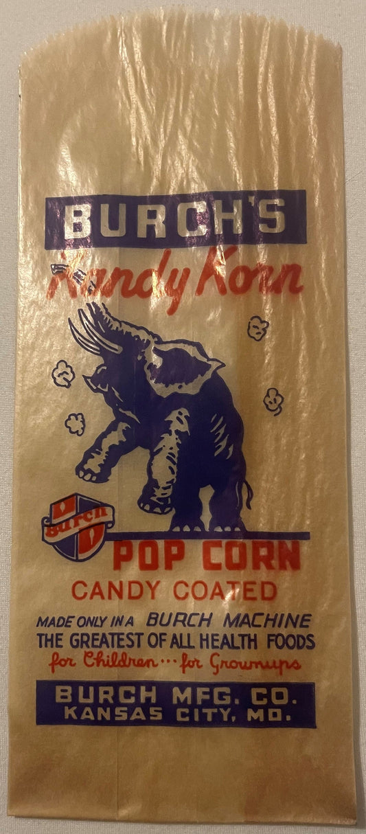 Vintage Burch's Kandy Korn popcorn bag with purple elephant logo and red text on kraft paper, Kansas City Missouri manufactur