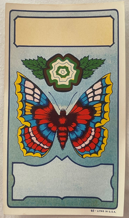 Antique lithograph broom label featuring a colorful butterfly with red, blue, and yellow patterned wings above a green flower