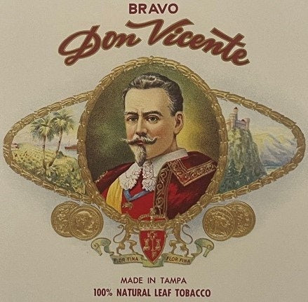 Vintage Bravo Don Vicente cigar box label featuring a bearded man in red military dress, palm trees, and gold decorative elem