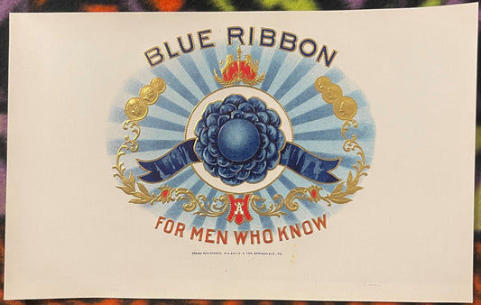 Antique embossed cigar label with blue ribbon rosette, gold ornaments, and text "For Men Who Know" on cream background