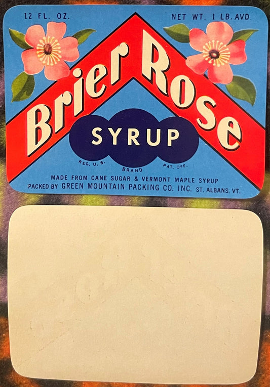 Vintage Brier Rose Syrup label with red chevron design, pink flowers, and blue background, showing blank reverse side below.
