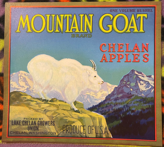 Vintage fruit crate label with white mountain goat on alpine landscape, yellow "Mountain Goat Brand" text, red "Chelan Apples