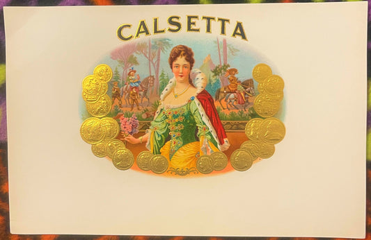 Antique Calsetta cigar label with gold embossed border of coins, featuring a regal woman in green dress with red cape against