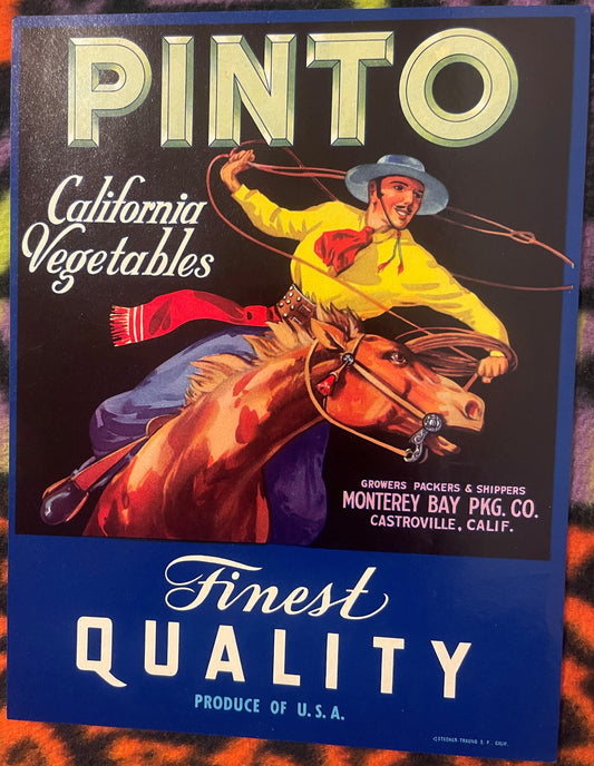 Vintage vegetable crate label featuring a cowboy on a rearing horse in yellow shirt, advertising Pinto brand California veget