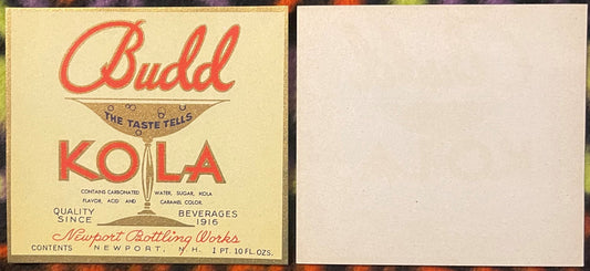 Vintage Budd Kola beverage label from Newport Bottling Works showing red script text and glass goblet illustration on cream-c