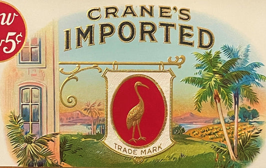 Vintage Crane's Imported cigar label featuring gold text, a golden crane on red background, tropical landscape, and 5¢ price