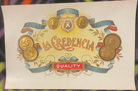 Antique La Credencia cigar box label featuring ornate gold coins, blue ribbons, red shield crest, and "Finest Havana Cigars B