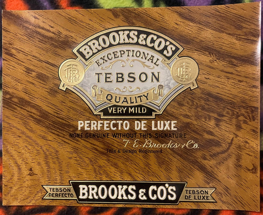 Antique cigar label with embossed gold and silver metallic design on woodgrain background reading "Brooks & Co's Exceptional