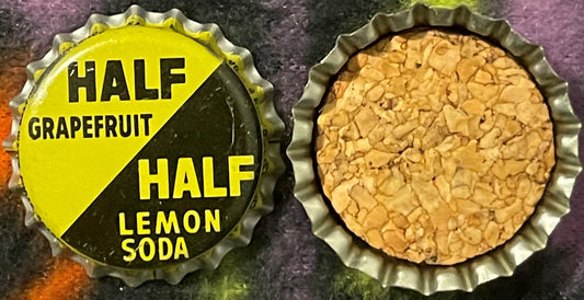 Vintage bottle cap showing yellow and black label reading "Half Grapefruit Half Lemon Soda" next to cork-lined interior, phot