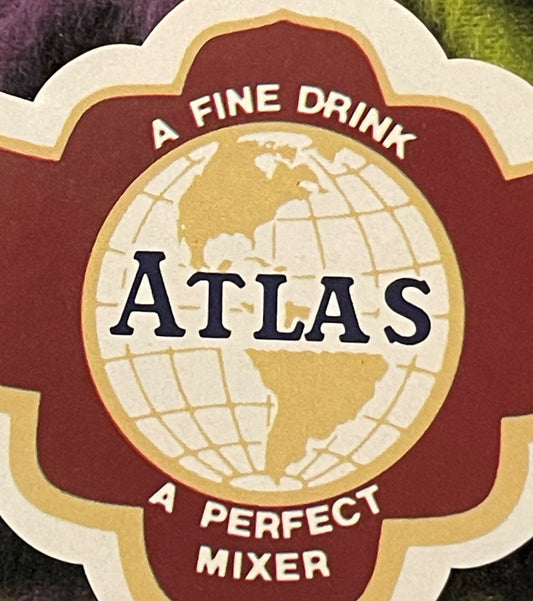 Vintage Atlas Cola label with globe design, red and gold colors, reading "A Fine Drink" and "A Perfect Mixer
