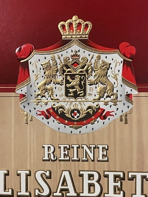 Ornate embossed cigar label with gold crown, heraldic coat of arms, red ribbons, and "REINE ELISABETH" text on cream and burg