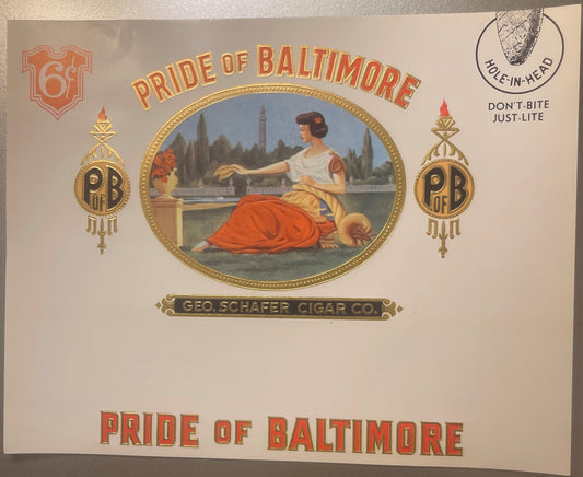 Vintage cigar label with gold foil embossing showing a woman in classical dress by a waterfront, "Pride of Baltimore" text, a