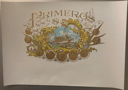 Ornate embossed gold cigar label with "Primer" text, decorative scrollwork, steamship vignette, and coin medallions on cream