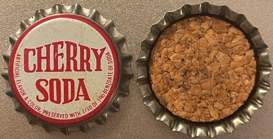 Vintage Cherry Soda bottle cap showing front and back, red and cream label with cork lining visible on reverse side.