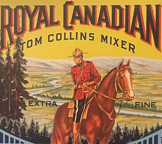 Vintage Royal Canadian Tom Collins Mixer label featuring a Mountie in red uniform on horseback overlooking a forested landsca