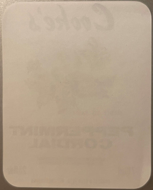 Blank cream-colored rectangular label with rounded corners against a gray surface, shown flat