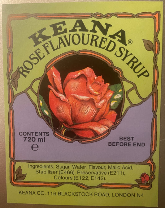 Vintage Keana rose-flavored syrup label, 720ml, with art nouveau border, red rose illustration, and ingredients list on yello