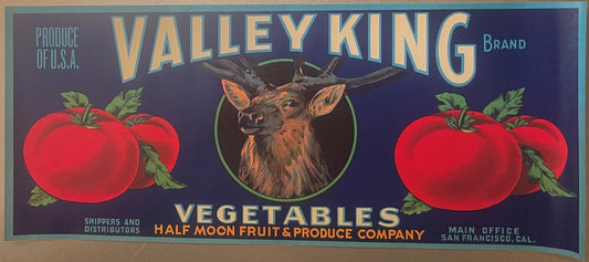 Vintage produce crate label featuring a deer head centered between red tomatoes on dark blue background, gold lettering readi