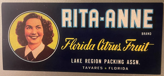 Vintage Rita-Anne brand Florida citrus fruit crate label featuring a woman's portrait in yellow circle on dark blue backgroun