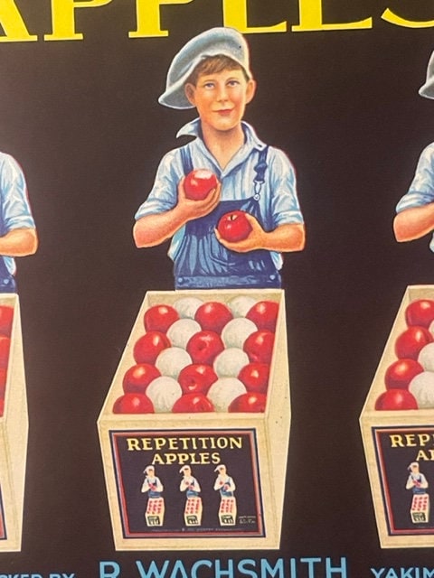 Vintage apple crate label featuring three illustrated boys in overalls and caps holding red apples above a wooden crate fille