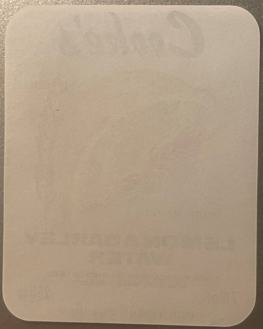 Back of the Cooke's Lemon & Barley Water label: plain paper with the lemon wedge and front lettering faintly showing through in reverse