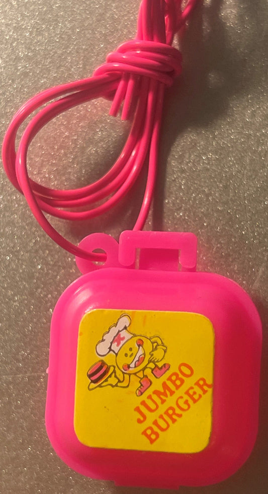 Pink plastic pendant with yellow square face featuring cartoon bee chef holding sandwich and red "Jumbo Burger" text, attache