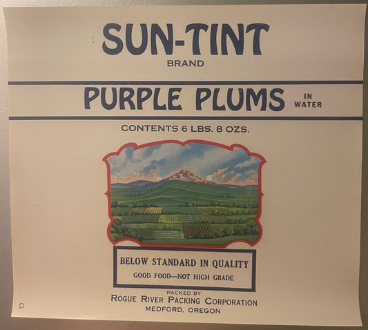 Vintage Sun-Tint brand purple plums label from Rogue River Packing Corporation, Medford Oregon, stating "Below Standard in Qu