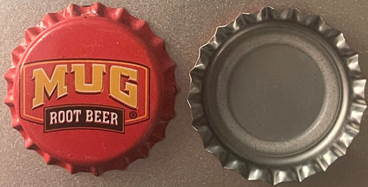 Vintage Mug Root Beer bottle cap showing red embossed front with gold lettering and silver metallic back side, displayed flat