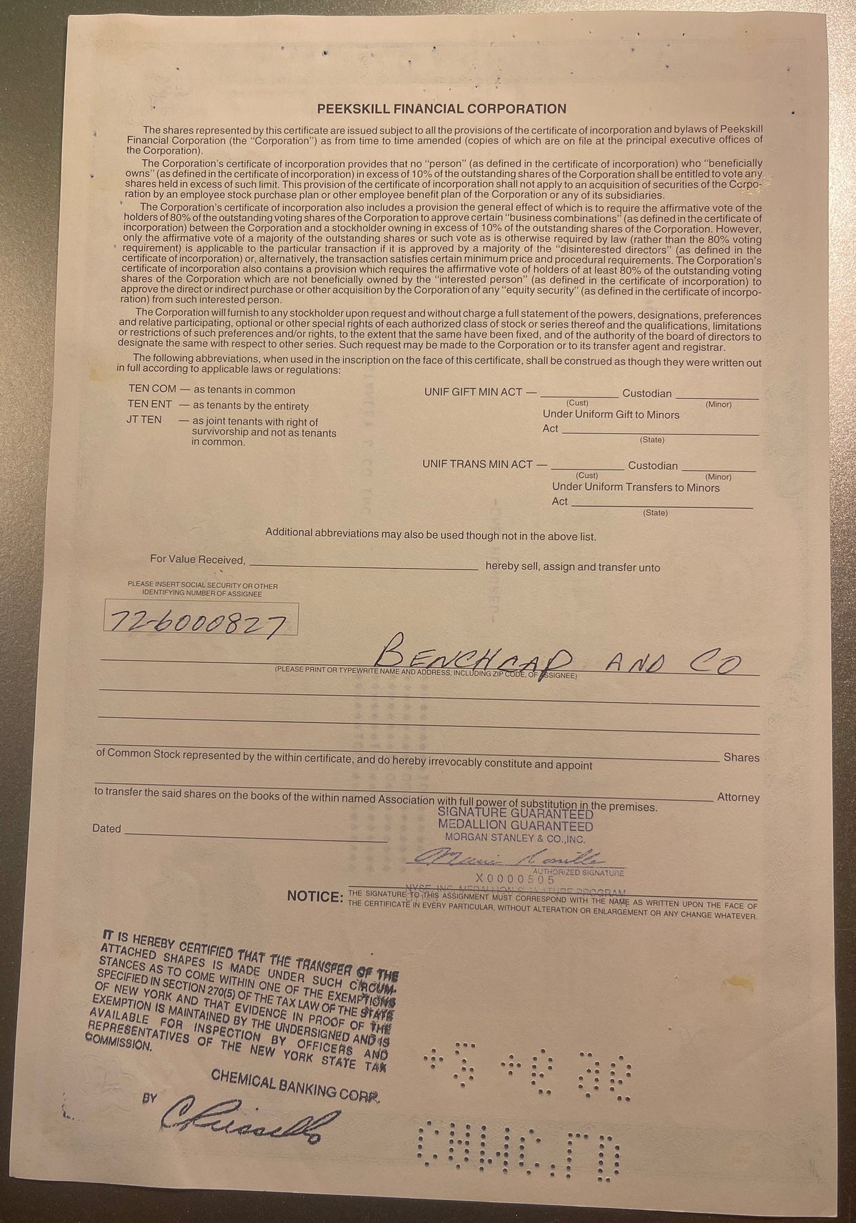 Aged Peekskill Financial Corporation stock certificate with handwritten assignee name "Benchar and Co" and social security nu
