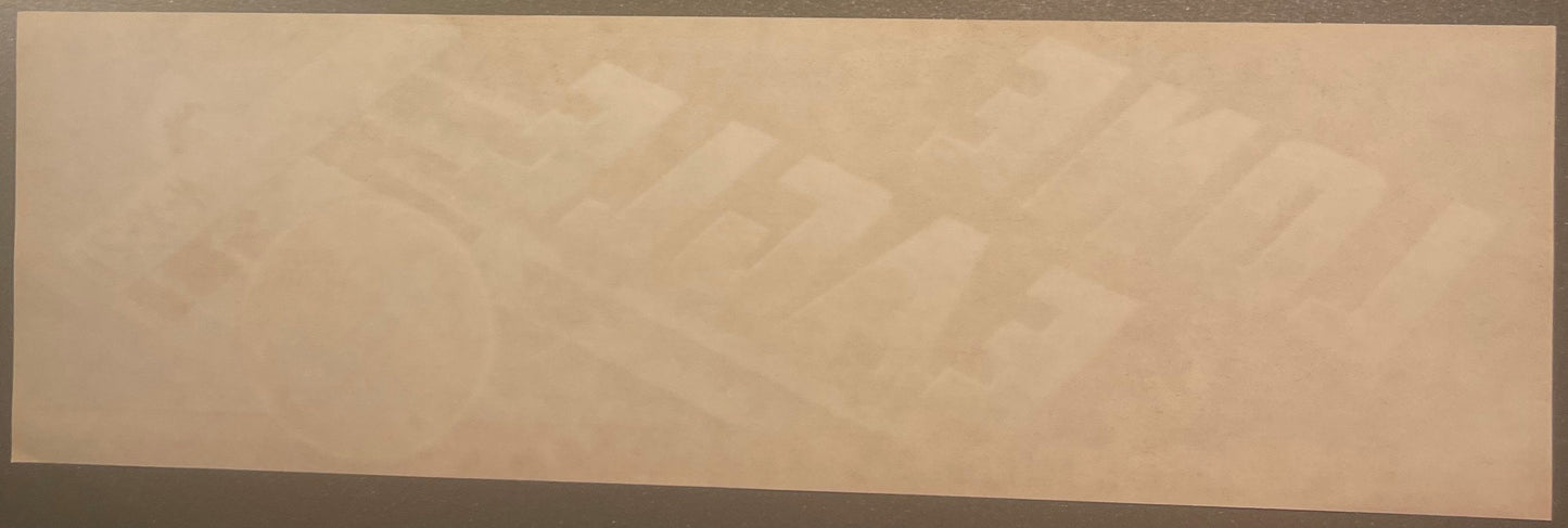 Faded vintage fruit crate label with embossed eagle design and text, displayed flat against neutral background
