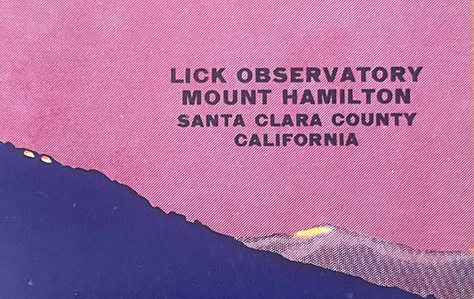 Vintage fruit crate label with pink diagonal stripe background, dark blue mountain silhouette, and black text reading "Lick O