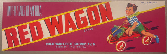 Vintage Red Wagon fruit crate label with red and yellow diagonal banner text, boy on red wagon illustration, Royal Valley Fru