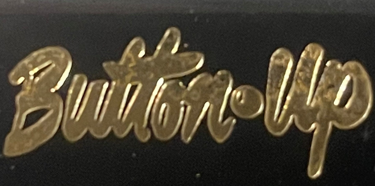 Gold-toned metal script spelling "Butterfly Clip" embossed on black background
