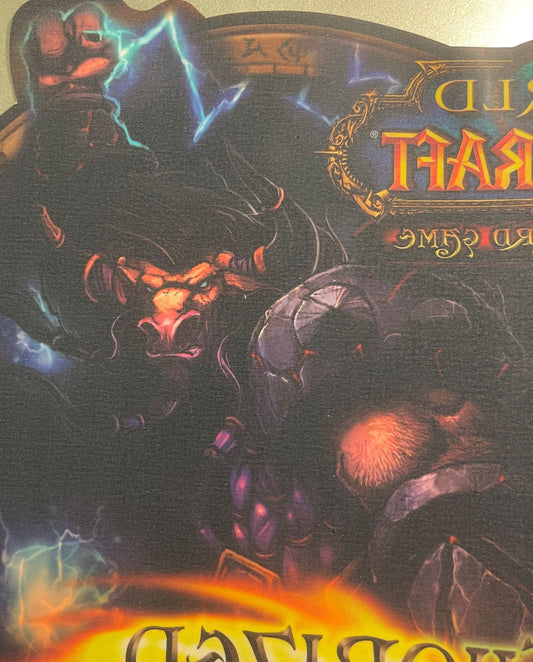 Vintage World of Warcraft TCG window cling featuring red demon character with blue lightning effects and gold title text on d