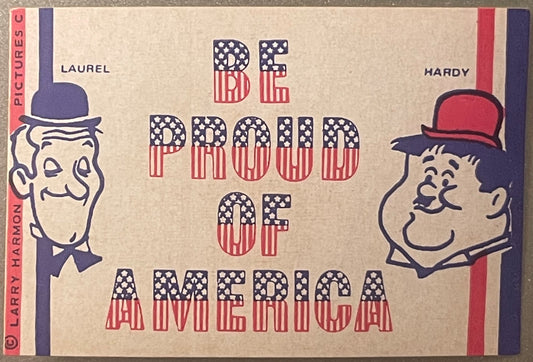 Vintage sticker sheet with Laurel and Hardy cartoon faces flanking red, white and blue text reading "BE PROUD OF AMERICA" on