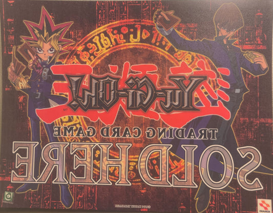 Retro Yu-Gi-Oh! trading card game window cling featuring red text logo, spiky-haired character Yugi on left, and hooded figur