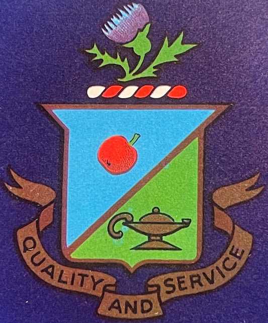 Vintage crate label featuring a shield with thistle flower, apple, and genie lamp, flanked by ribbons reading "Quality and Se