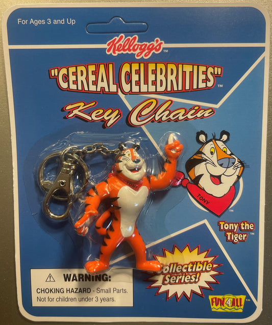 Sealed 1998 Kellogg's Cereal Celebrities Tony the Tiger orange keychain on blue packaging card with warning label visible